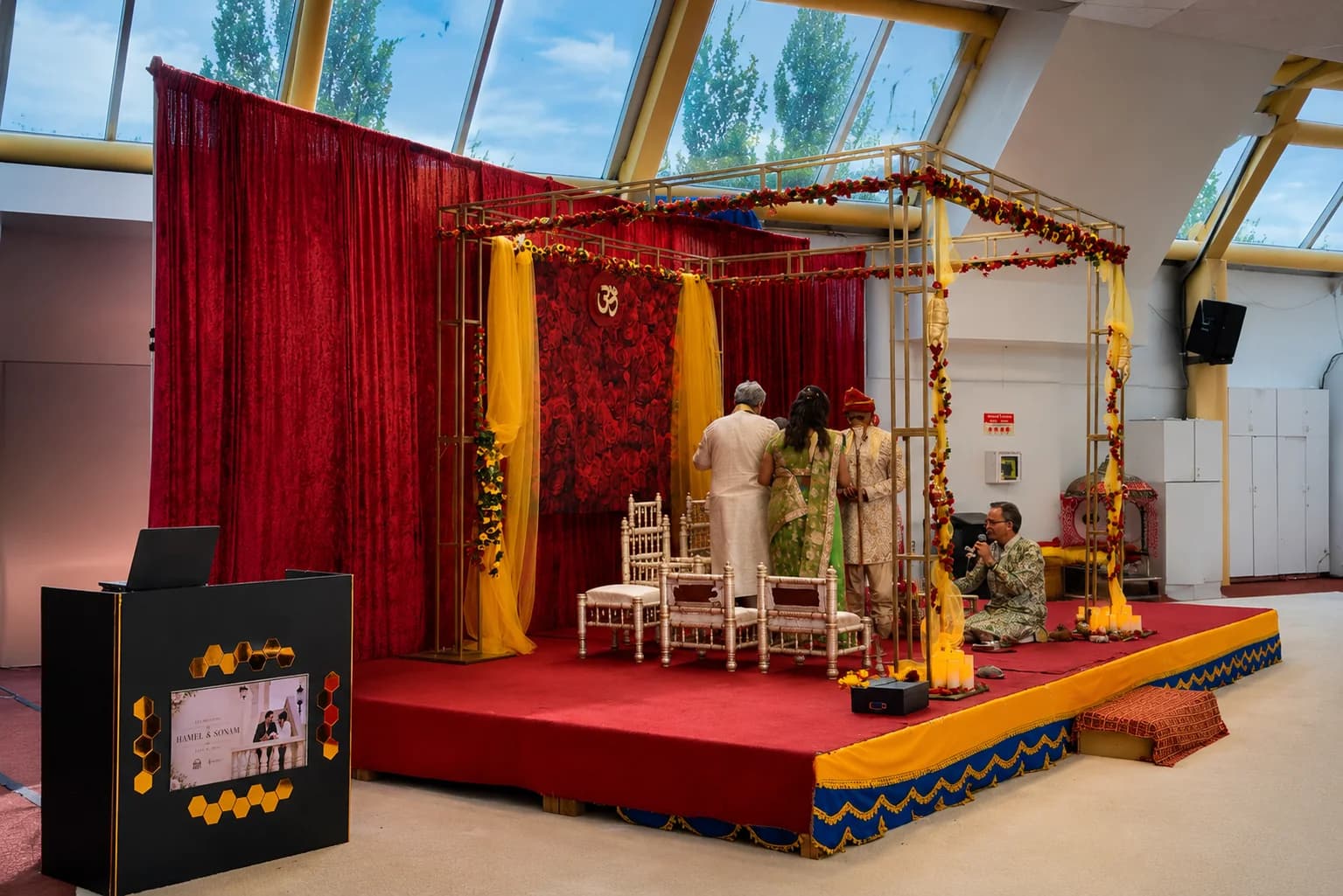 Gujarati wedding ceremony with a decorated mandap and DJ H3T booth